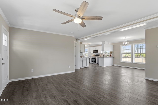 176 Clear Water Dr, Smithfield, NC 27577 - unfurnished living room with dark wood-style flooring, ceiling fan, baseboards, crown molding, and a chandelier