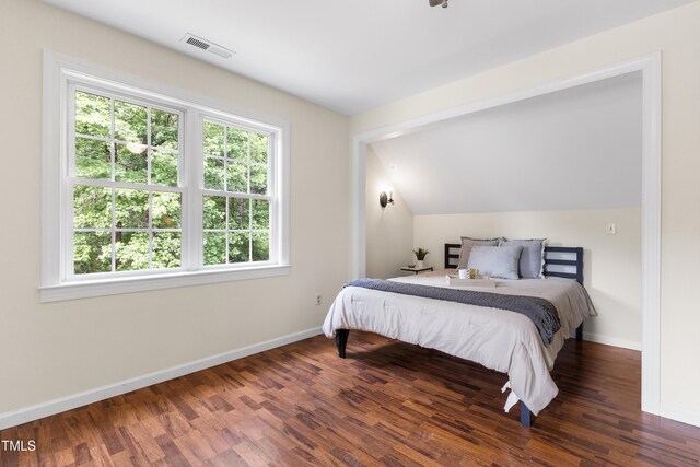 5237 Christian Light Rd, Fuquay Varina, NC 27526 - bedroom featuring wood finished floors, baseboards, and vaulted ceiling