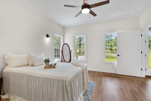 5237 Christian Light Rd, Fuquay Varina, NC 27526 - bedroom with wood finished floors, baseboards, and a ceiling fan