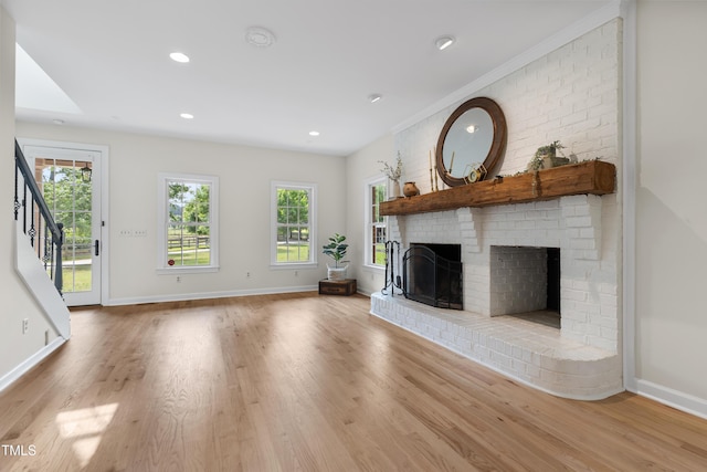 5237 Christian Light Rd, Fuquay Varina, NC 27526 - unfurnished living room featuring wood finished floors, a fireplace, baseboards, healthy amount of natural light, and recessed lighting