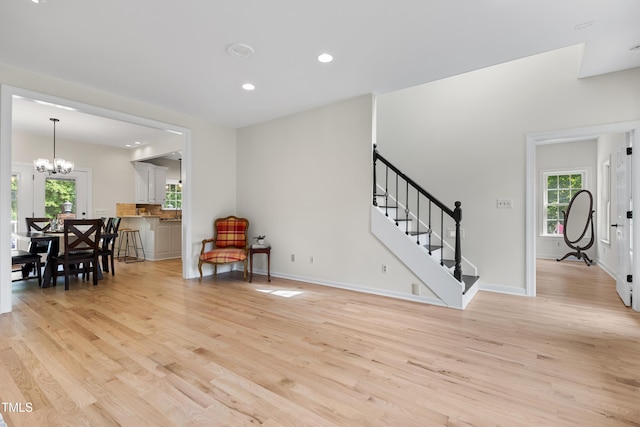 5237 Christian Light Rd, Fuquay Varina, NC 27526 - entrance foyer featuring light wood-style flooring, a chandelier, healthy amount of natural light, stairway, and recessed lighting