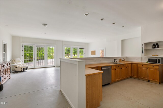 5237 Christian Light Rd, Fuquay Varina, NC 27526 - kitchen with stainless steel appliances, concrete floors, open floor plan, and a sink