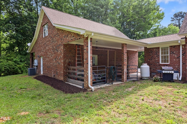 5237 Christian Light Rd, Fuquay Varina, NC 27526 - view of side of property with brick siding, central AC unit, and roof with shingles