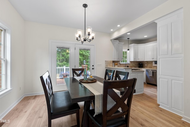 5237 Christian Light Rd, Fuquay Varina, NC 27526 - dining space featuring light wood-type flooring, a chandelier, baseboards, and recessed lighting
