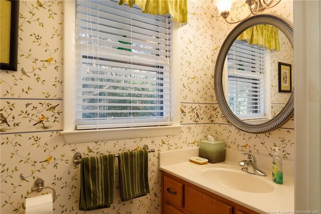 2427 Colgate Dr, Fayetteville, NC 28304 - bathroom with wallpapered walls and vanity