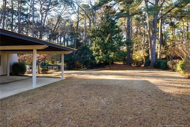 2427 Colgate Dr, Fayetteville, NC 28304 - view of yard featuring a carport
