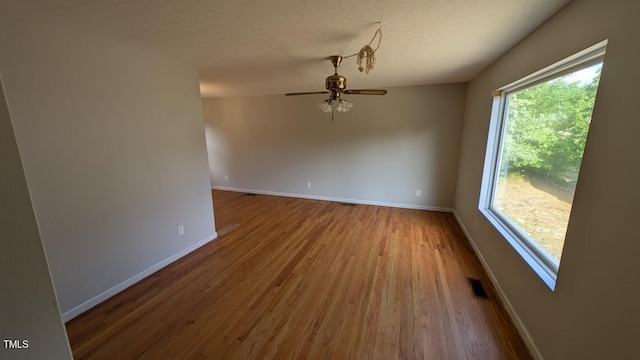 5240 Chesapeake Rd, Fayetteville, NC 28311 - unfurnished room featuring baseboards, a ceiling fan, and wood finished floors