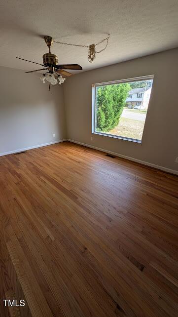 5240 Chesapeake Rd, Fayetteville, NC 28311 - empty room with baseboards, wood finished floors, and a ceiling fan