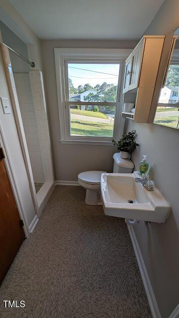 5240 Chesapeake Rd, Fayetteville, NC 28311 - full bath with a stall shower, a sink, toilet, and baseboards