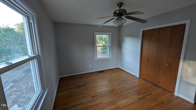 5240 Chesapeake Rd, Fayetteville, NC 28311 - unfurnished bedroom with wood finished floors, baseboards, a closet, and ceiling fan