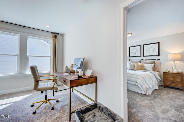 carpeted home office featuring baseboards