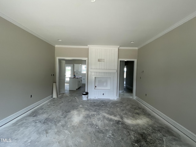 508 S Vance St, Fremont, NC 27830 - unfurnished living room featuring unfinished concrete flooring, ornamental molding, and baseboards