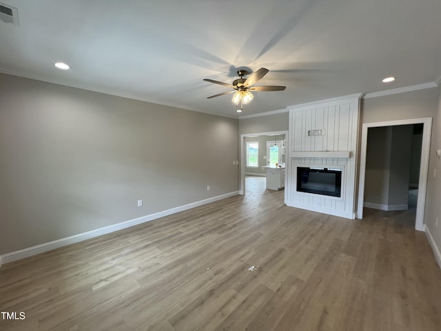 508 S Vance St, Fremont, NC 27830 - unfurnished living room featuring ceiling fan, light wood-style flooring, ornamental molding, recessed lighting, and a fireplace