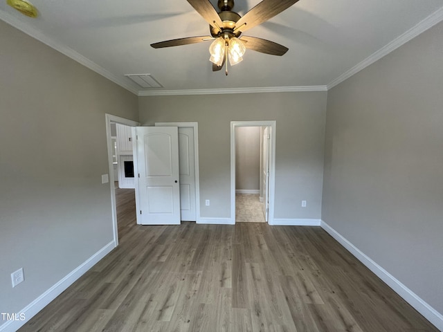 508 S Vance St, Fremont, NC 27830 - unfurnished bedroom with wood finished floors, ornamental molding, a closet, and ceiling fan