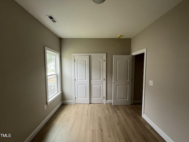 508 S Vance St, Fremont, NC 27830 - unfurnished bedroom featuring light wood-style flooring and a closet