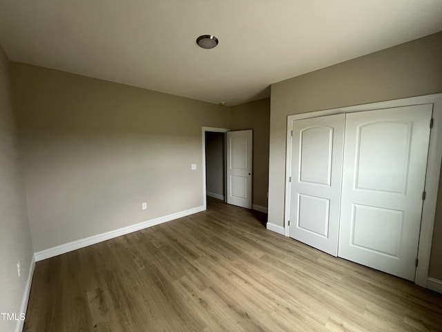 508 S Vance St, Fremont, NC 27830 - unfurnished bedroom featuring light wood-style floors and a closet