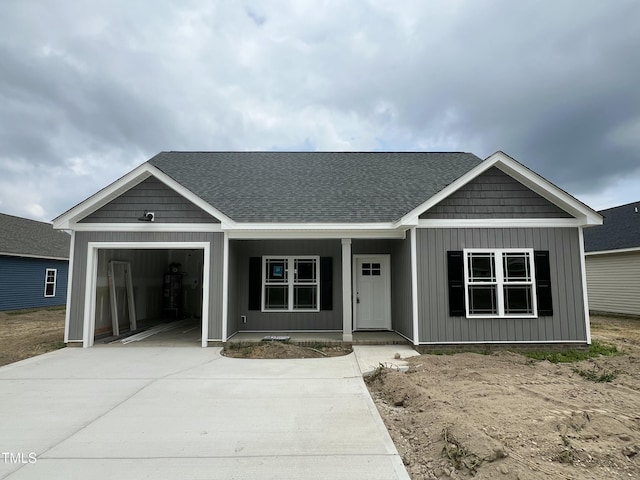 508 S Vance St, Fremont, NC 27830 - view of front of property with a porch, driveway, an attached garage, and a shingled roof