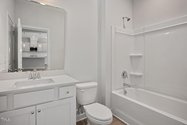 full bathroom with toilet, tub / shower combination, and vanity