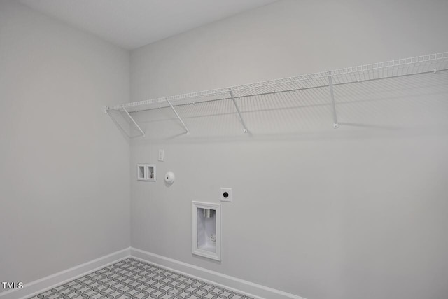 clothes washing area featuring hookup for a gas dryer, laundry area, electric dryer hookup, hookup for a washing machine, and baseboards