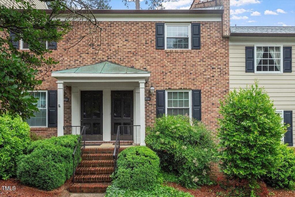 3720 Jamestown Cir, Raleigh, NC 27609 - view of exterior entry with brick siding
