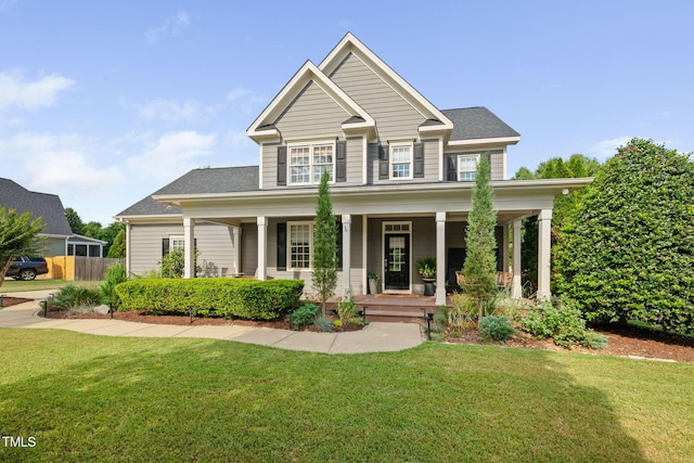 4769 Swordfish Dr, Raleigh, NC 27603 - view of front of home featuring a front yard, a porch, and roof with shingles