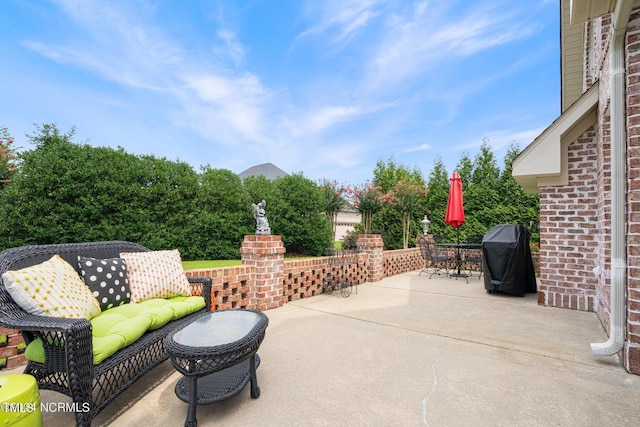 view of patio with a grill