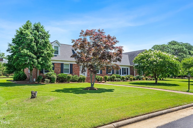 504 W Brocklyn St, Benson, NC 27504 - view of front of property featuring brick siding, a front lawn, and roof with shingles