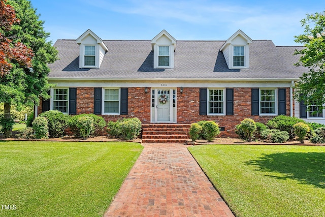 504 W Brocklyn St, Benson, NC 27504 - cape cod home with roof with shingles, a front lawn, and brick siding