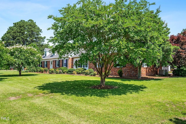 504 W Brocklyn St, Benson, NC 27504 - view of front of property with brick siding and a front lawn
