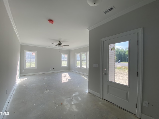foyer entrance featuring crown molding, visible vents, baseboards, ceiling fan, and concrete floors