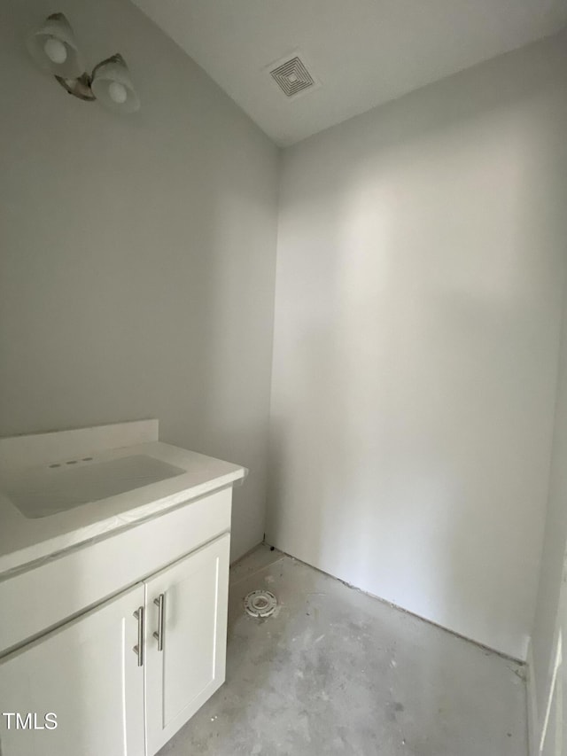 bathroom featuring visible vents, concrete floors, and vanity