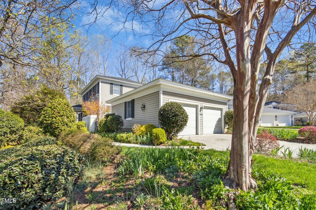 1309 Langdon Pl, Pittsboro, NC 27312 - view of side of property featuring driveway and an attached garage