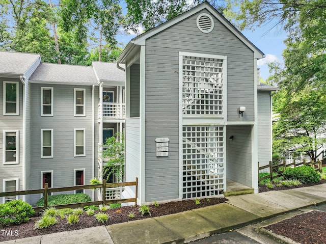 view of front of house with fence