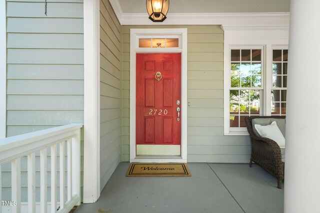 doorway to property featuring covered porch