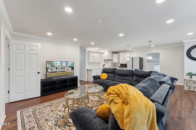 living area featuring ornamental molding, baseboards, recessed lighting, and dark wood finished floors