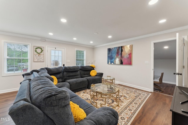 living room featuring recessed lighting, dark wood-type flooring, baseboards, and ornamental molding