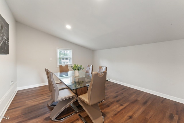 dining room with dark wood-style flooring, baseboards, recessed lighting, and lofted ceiling
