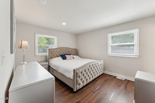 bedroom featuring recessed lighting, visible vents, baseboards, and dark wood finished floors