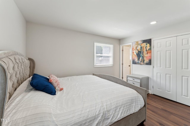 bedroom with wood finished floors, a closet, and recessed lighting
