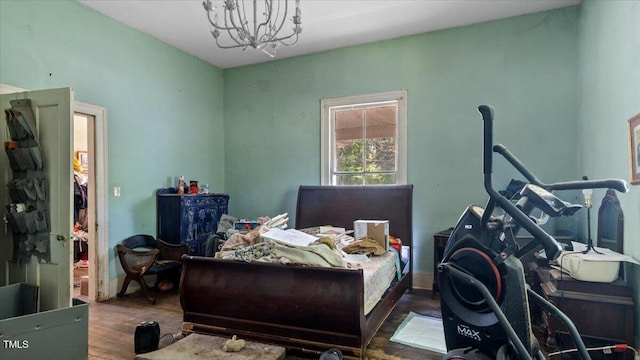 410 Halifax St, Warrenton, NC 27589 - bedroom with a notable chandelier and wood finished floors