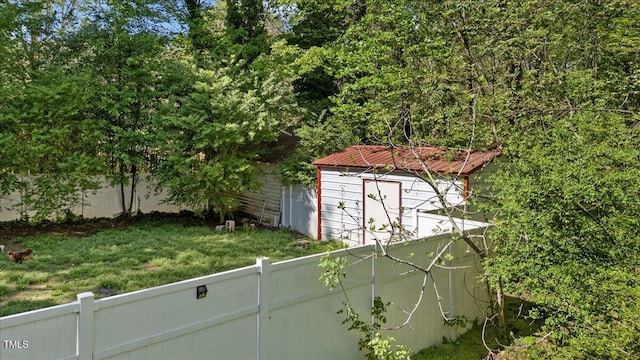 410 Halifax St, Warrenton, NC 27589 - view of outbuilding with a fenced backyard and an outdoor structure
