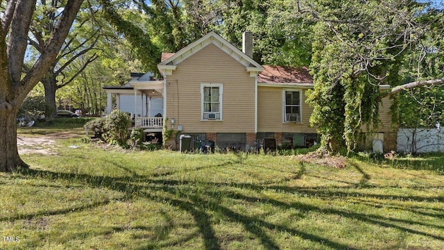 410 Halifax St, Warrenton, NC 27589 - back of house featuring a yard and a chimney