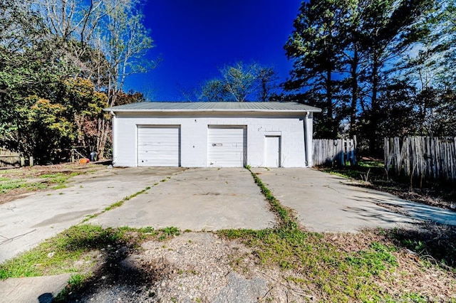 detached garage with fence