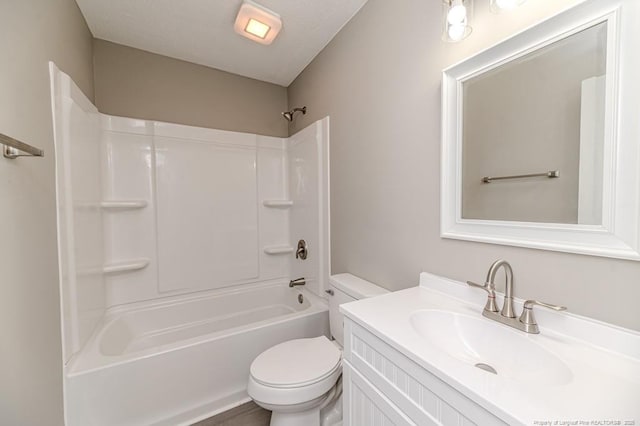 bathroom with vanity, bathing tub / shower combination, and toilet