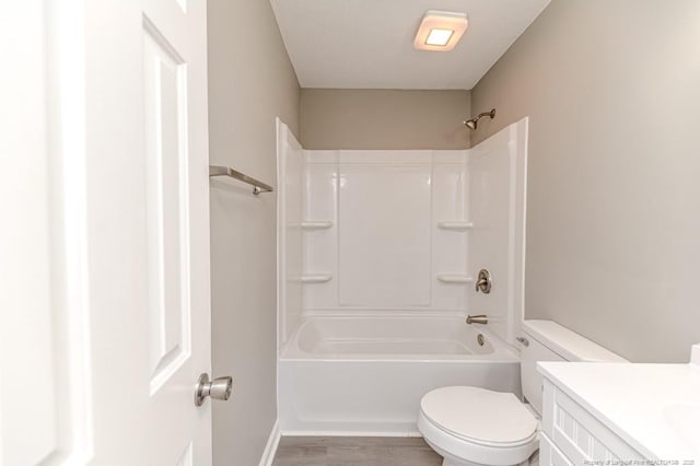 full bath featuring vanity, wood finished floors, and toilet