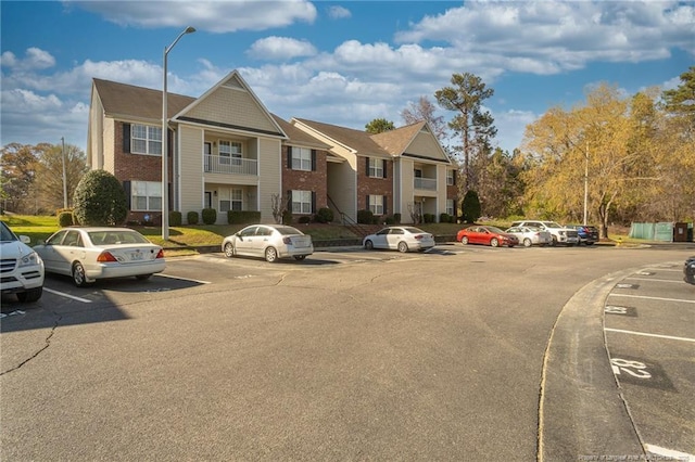 3159 Wisteria Ln Unit 101, Fayetteville, NC 28314 - view of property with uncovered parking and a residential view
