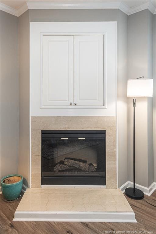 3159 Wisteria Ln Unit 101, Fayetteville, NC 28314 - details featuring baseboards, ornamental molding, a high end fireplace, and wood finished floors