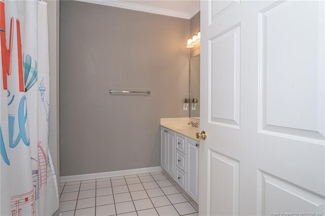 3159 Wisteria Ln Unit 101, Fayetteville, NC 28314 - bathroom featuring tile patterned floors, crown molding, baseboards, and vanity