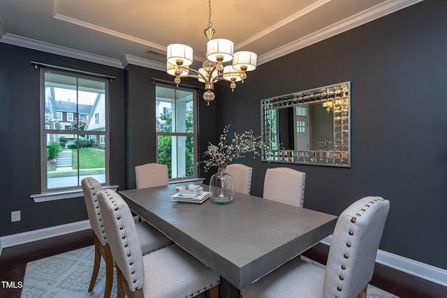 4026 Overcup Oak Ln, Cary, NC 27519 - dining space featuring a chandelier, wood finished floors, baseboards, crown molding, and a raised ceiling