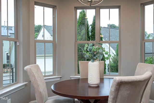 4026 Overcup Oak Ln, Cary, NC 27519 - dining room featuring healthy amount of natural light, baseboards, and a chandelier